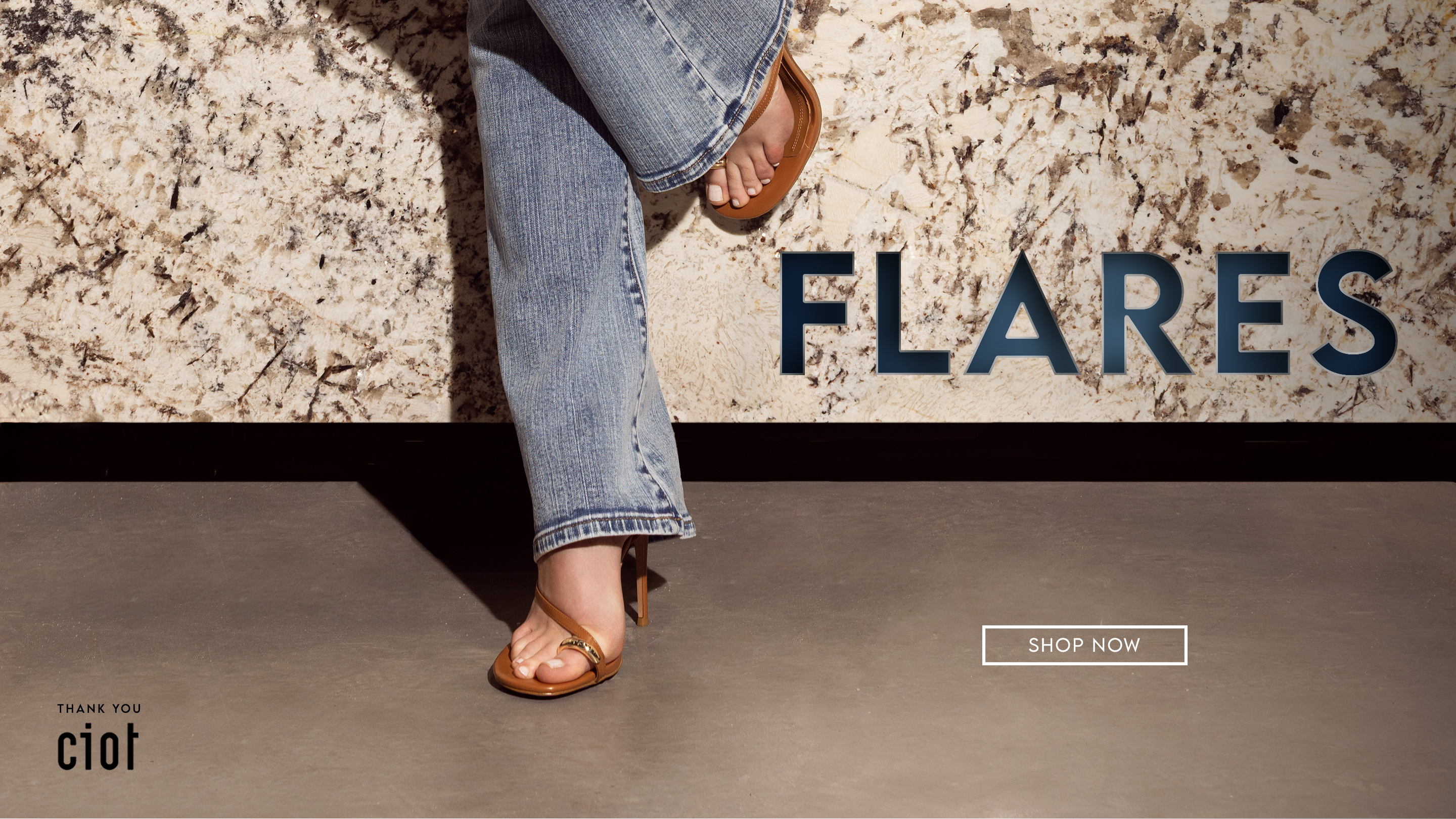 Descriptive text: Flares. Woman wearing light wash Parasuco jeans and brown kitten heels.