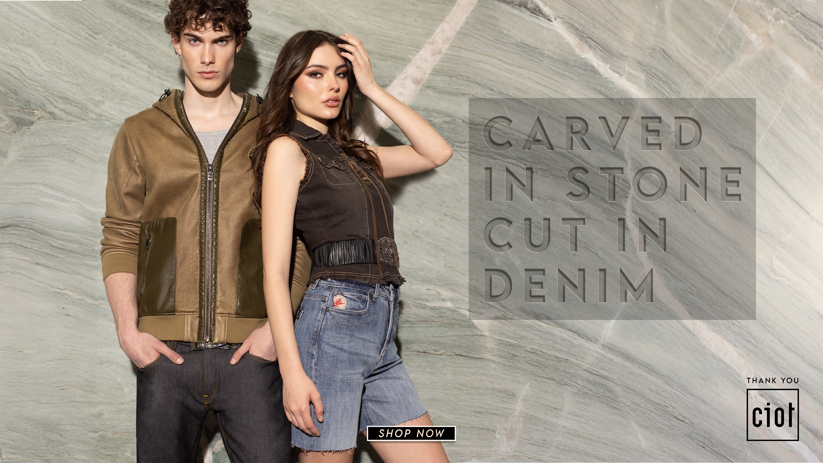 Men wearing a hooded zip top and raw denim jeans. women wearing a vintage top and light denim jorts