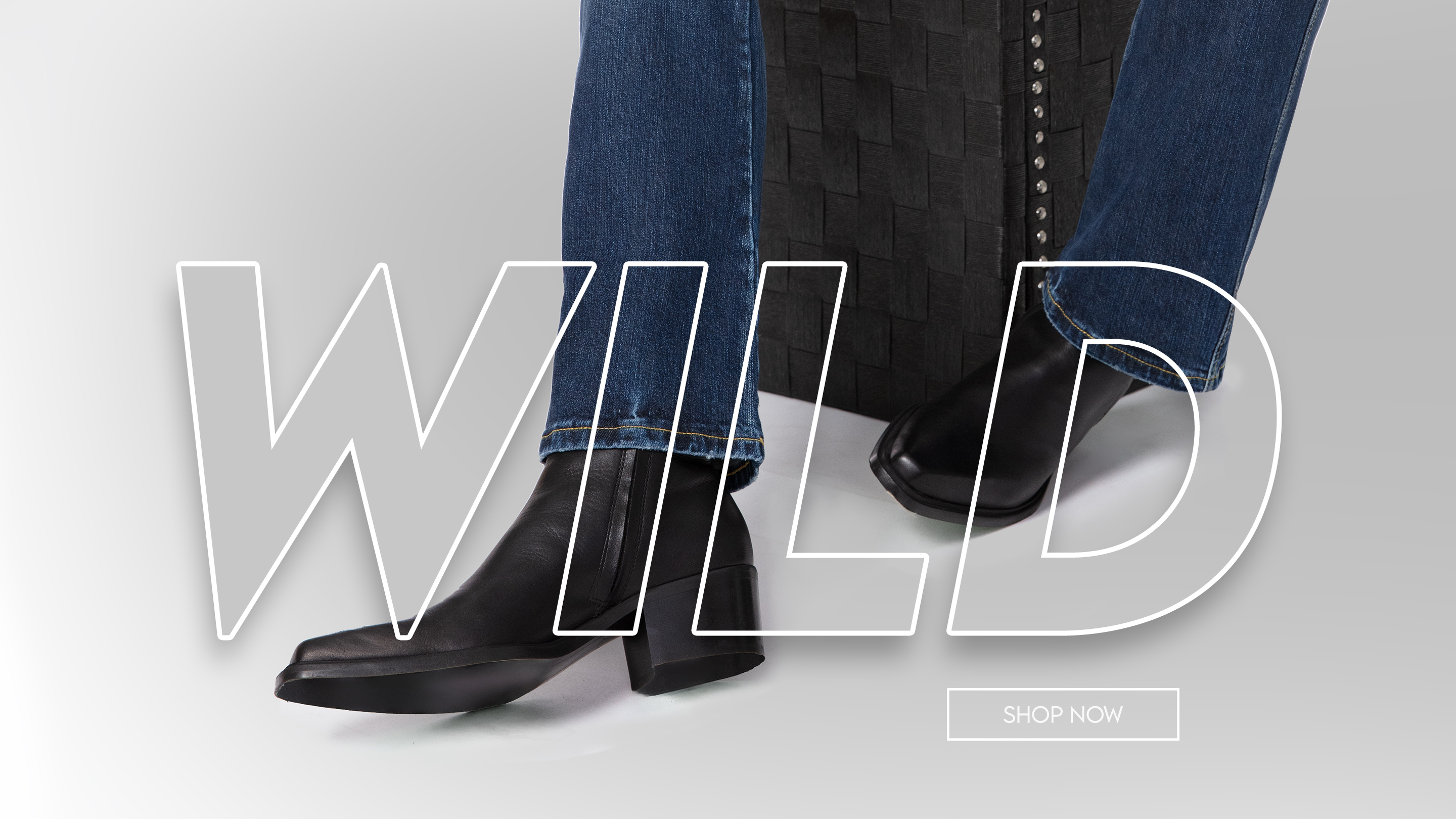 Large banner divided into three sections, 3/3. A low-angle, cropped shot of a person's legs and feet. The person is wearing well-worn, flared blue jeans with frayed hems and white sneakers with black stripes. They are standing on a dirt path with their feet slightly apart. In the background, the undercarriage of a vehicle and two large tires are visible, along with a trailer hitch featuring a small Canadian maple leaf emblem.