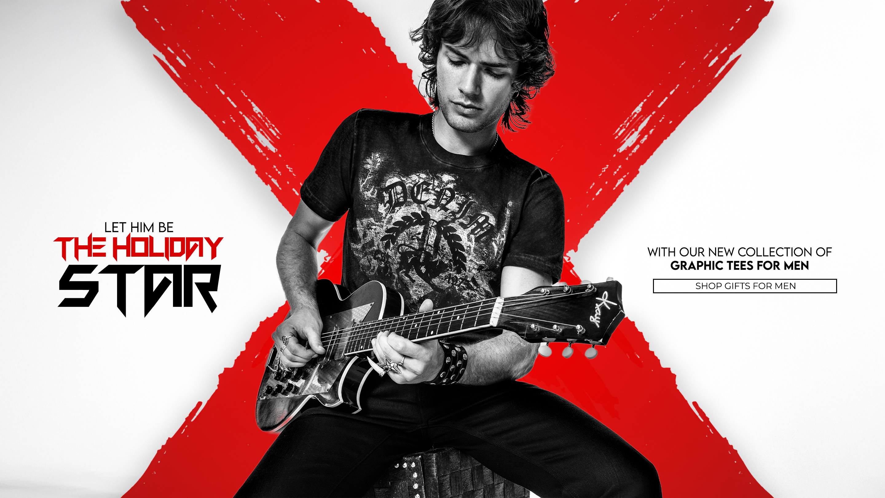 A muscular man with short hair and tattoos stands in profile, leaning on a rustic wooden fence. He is wearing a black, sleeveless top with a white graphic print, black leather pants, and red motorcycle boots. He holds a red and black helmet in his left hand. The background is a dirt road bordered by trees, with sunlight filtering through the leaves. The image has a dark, vertical overlay on the left side with the text 'SHOW THEM GUNS THE NEW MUSCLE TEE' and 'SHOP THE 9703NS.'